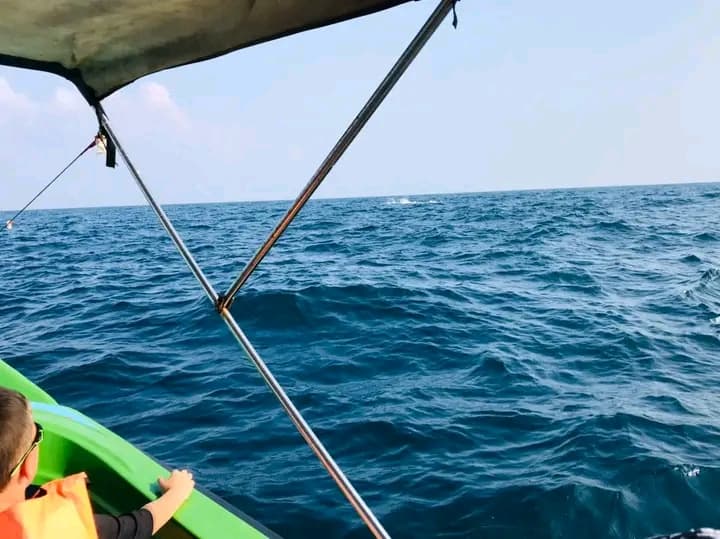 The bow of the boat cutting through deep blue water