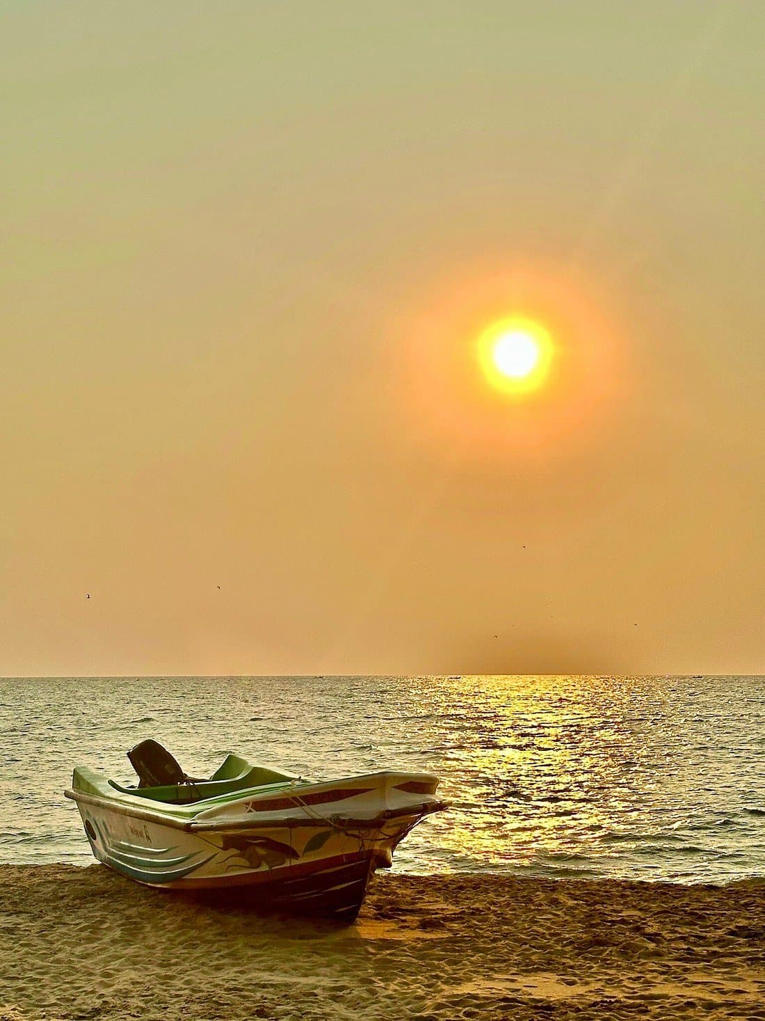 The sun rising over a calm Indian Ocean horizon