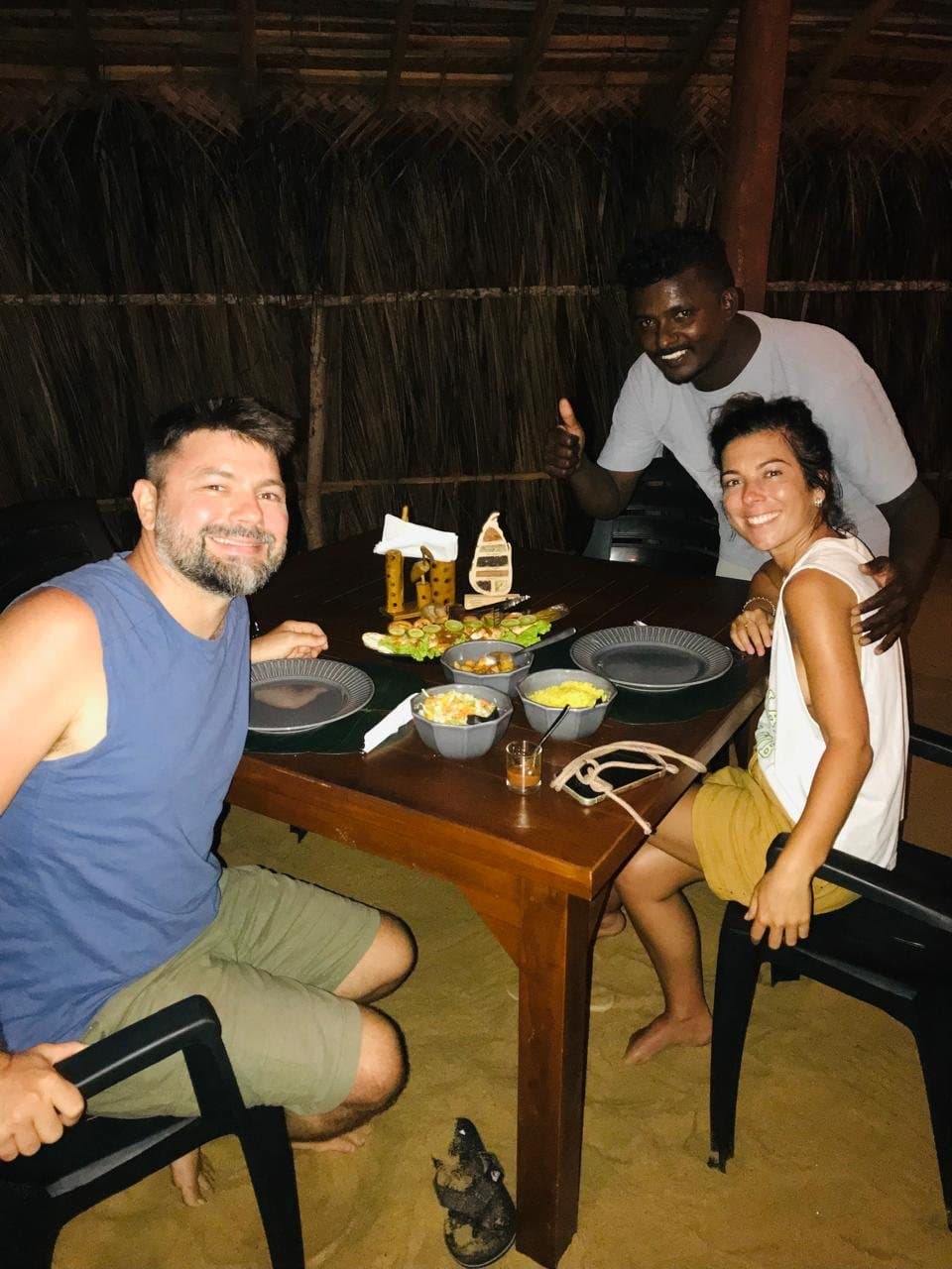 A couple enjoying dinner with Maduka