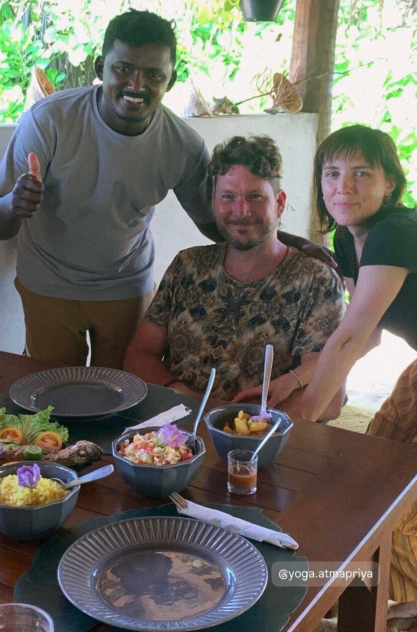 Guests at a lunch table with Maduka