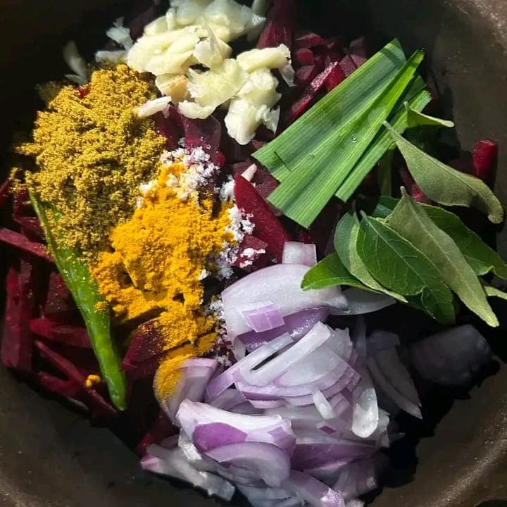 A clay pot of beetroot, red onion, chilli, curry leaves and roasted curry powder